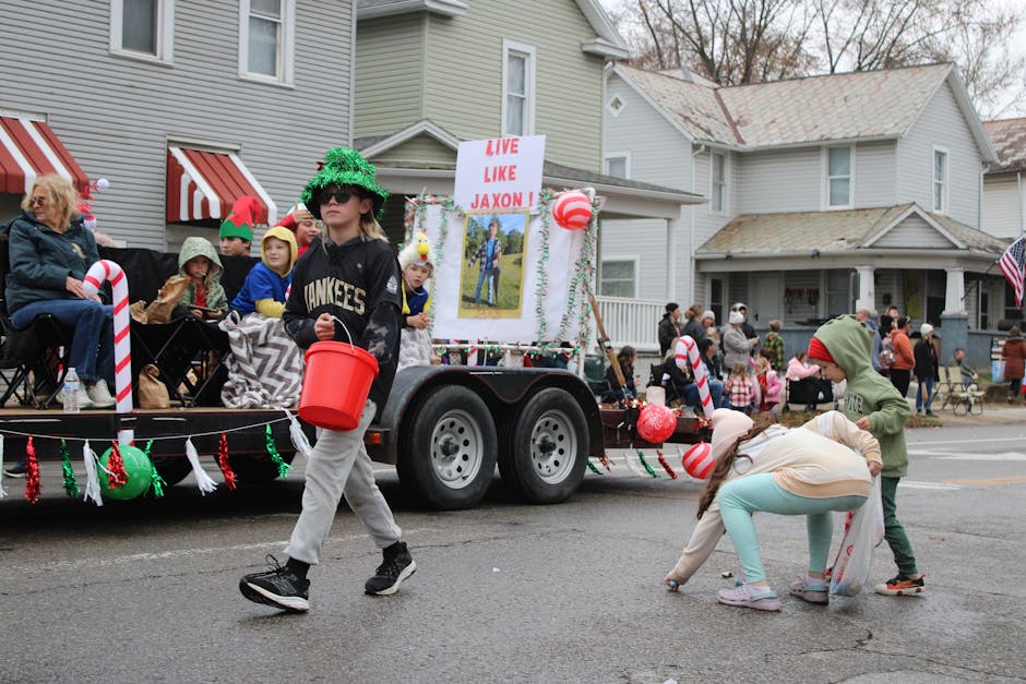 Colorful holiday parade scene in Lancaster, Ohio featuring children and families enjoying the festive atmosphere.
